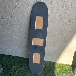 Skateboard turned picture frame